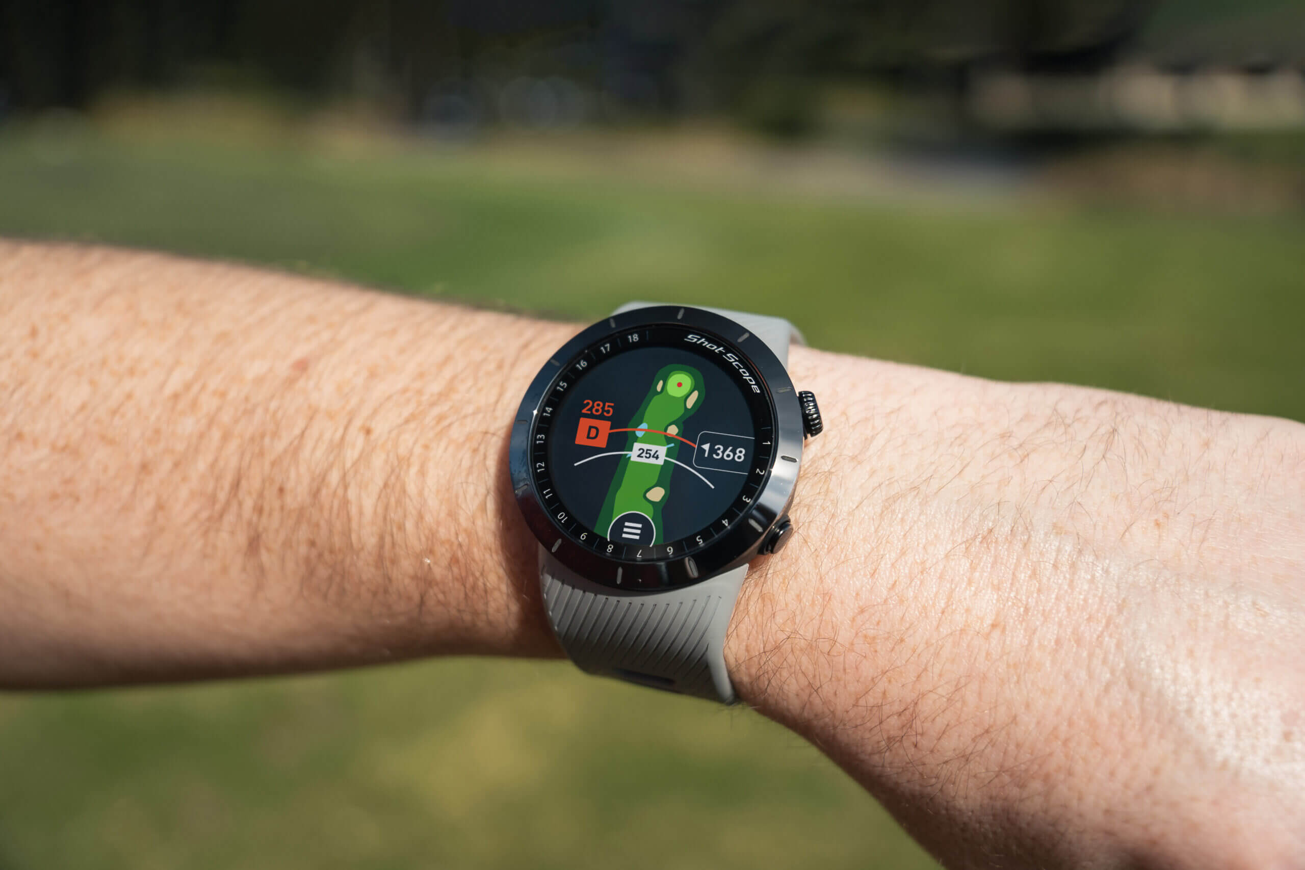 A Shot Scope X5 Golf GPS Watch displaying the hole mapping feature.