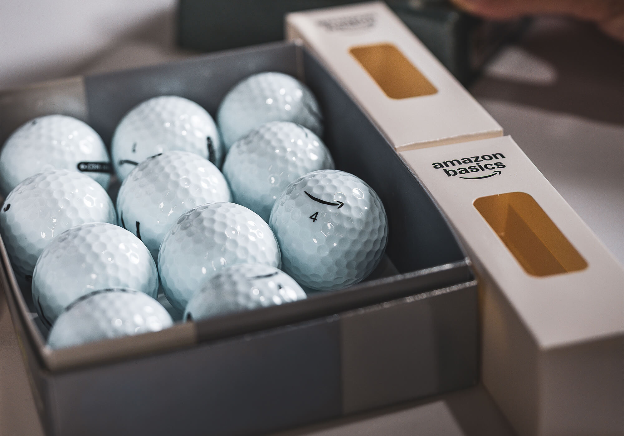 A box of Amazon Basics essential soft balls