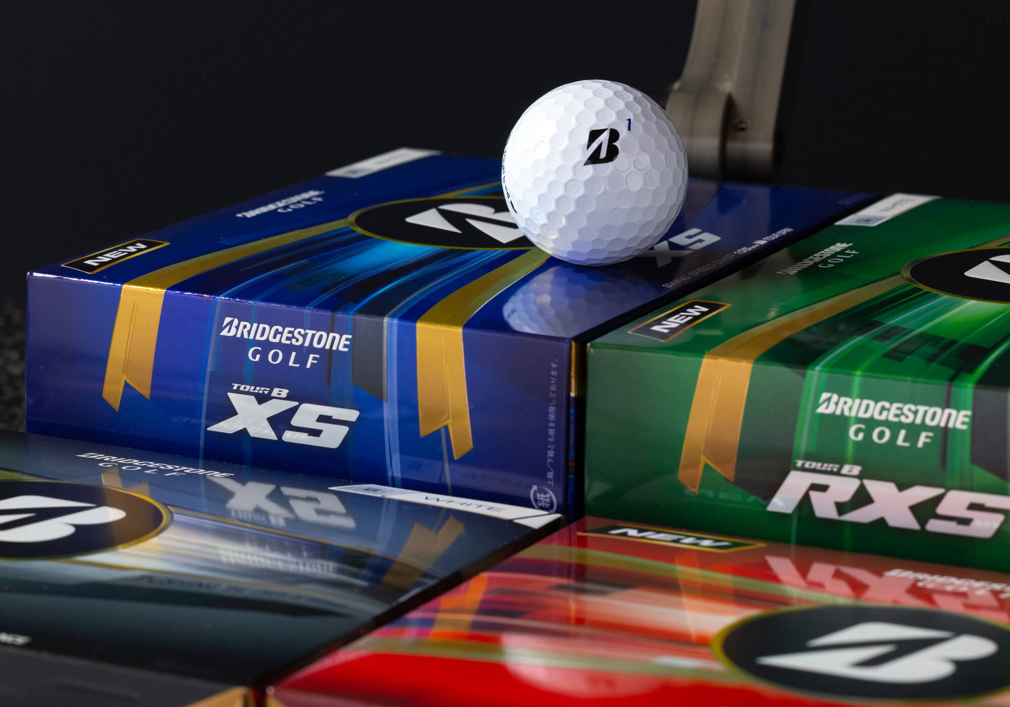 Bridgestone TOUR B RXS golf ball on bright packaging