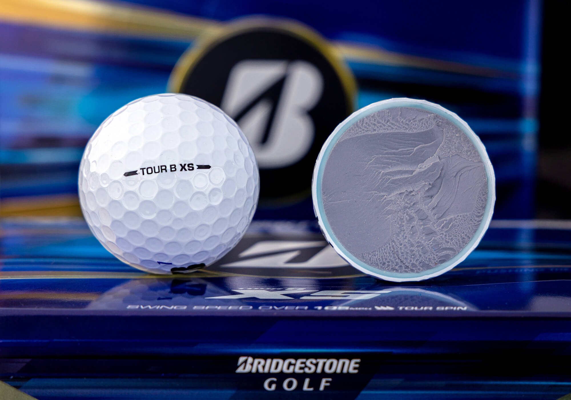 Bridgestone TOUR B XS golf ball with visible core.