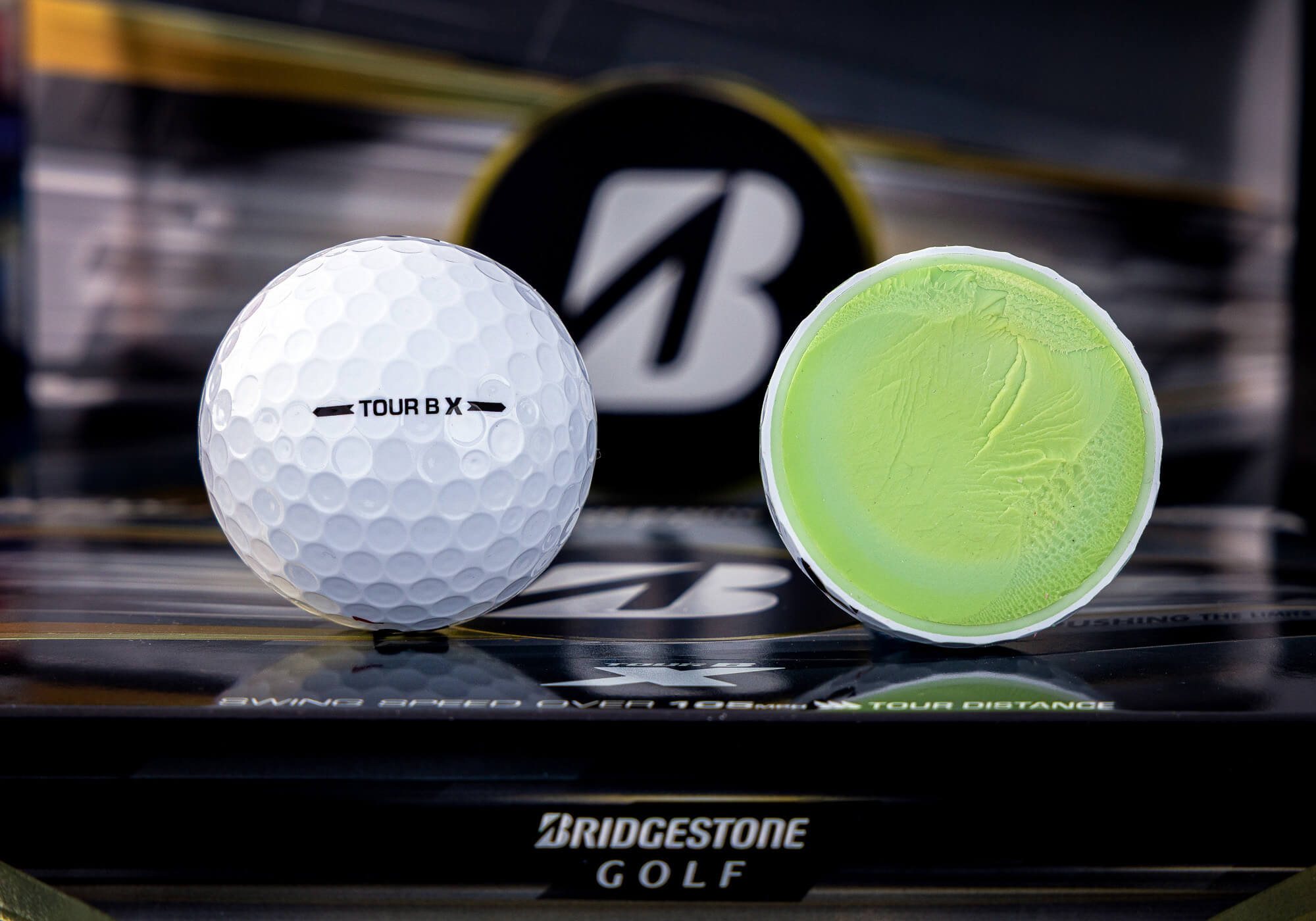 Bridgestone TOUR B X golf ball with visible core.