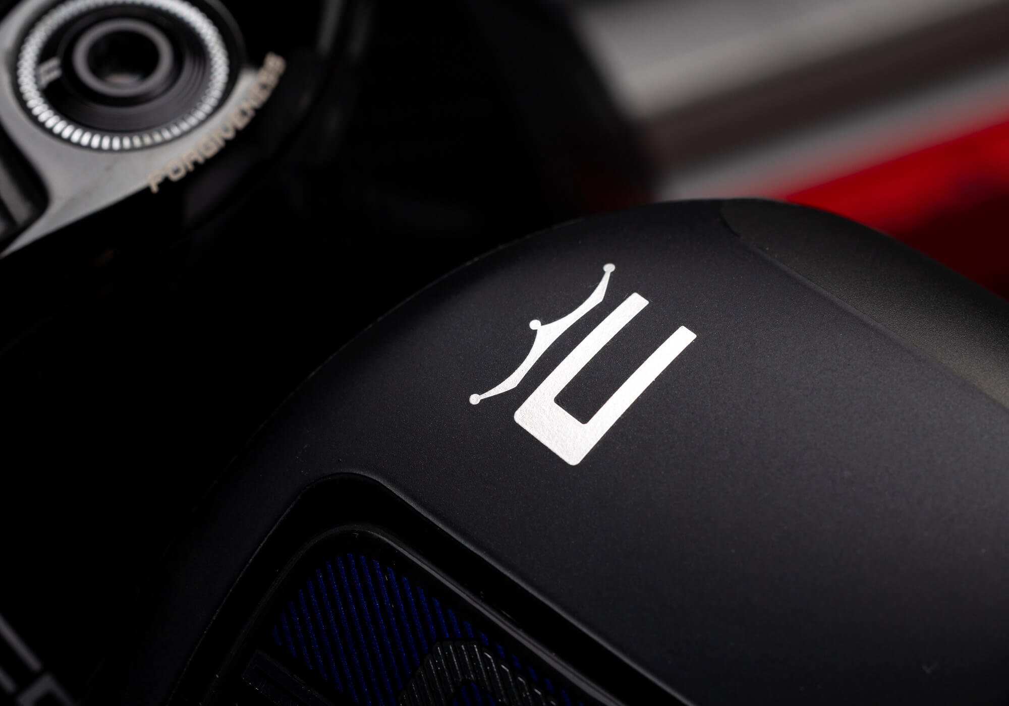 A closeup of the COBRA logo on the toe of the OPTM Driver