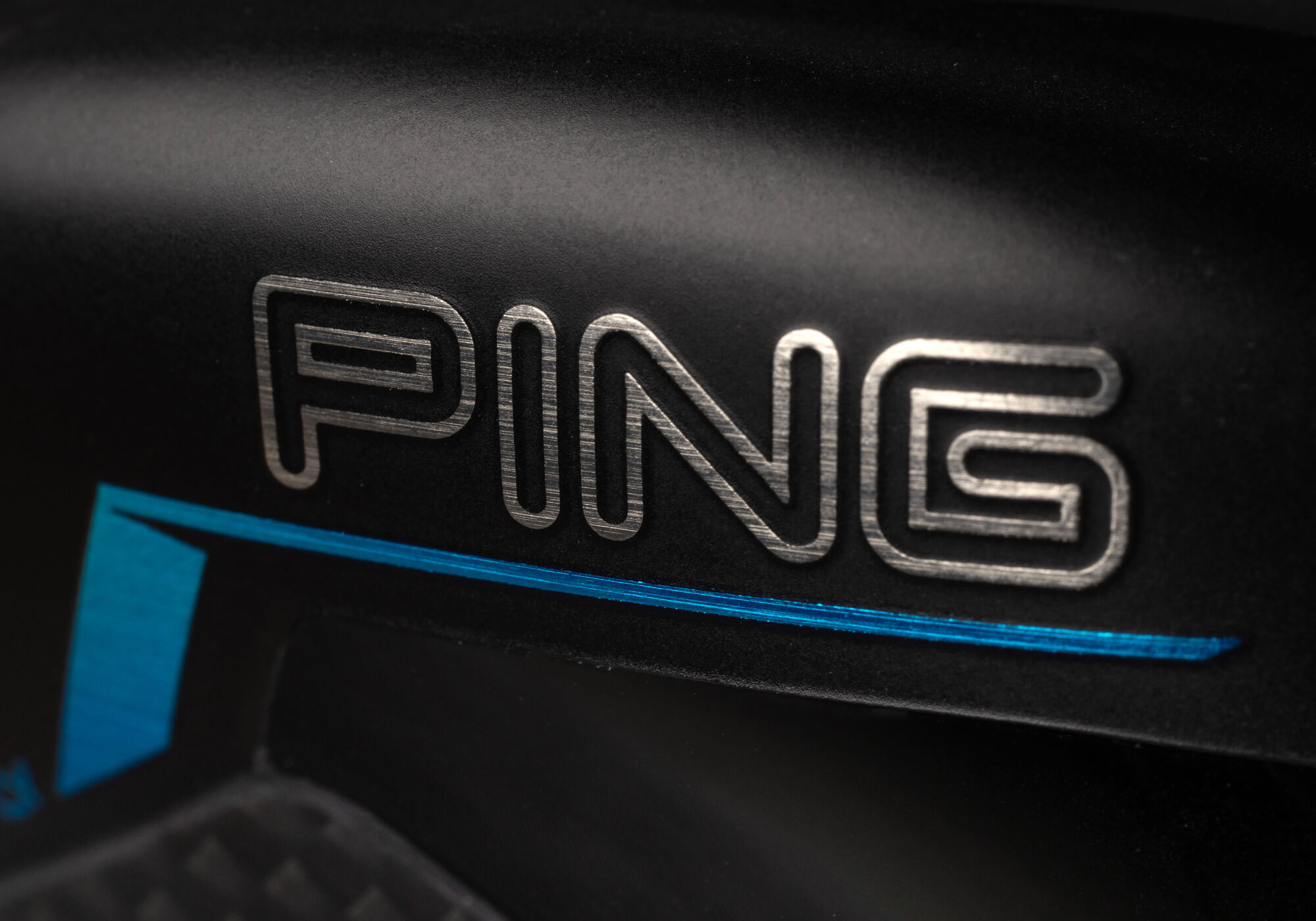 a closeup of the PING logo on the PING G440 K Driver