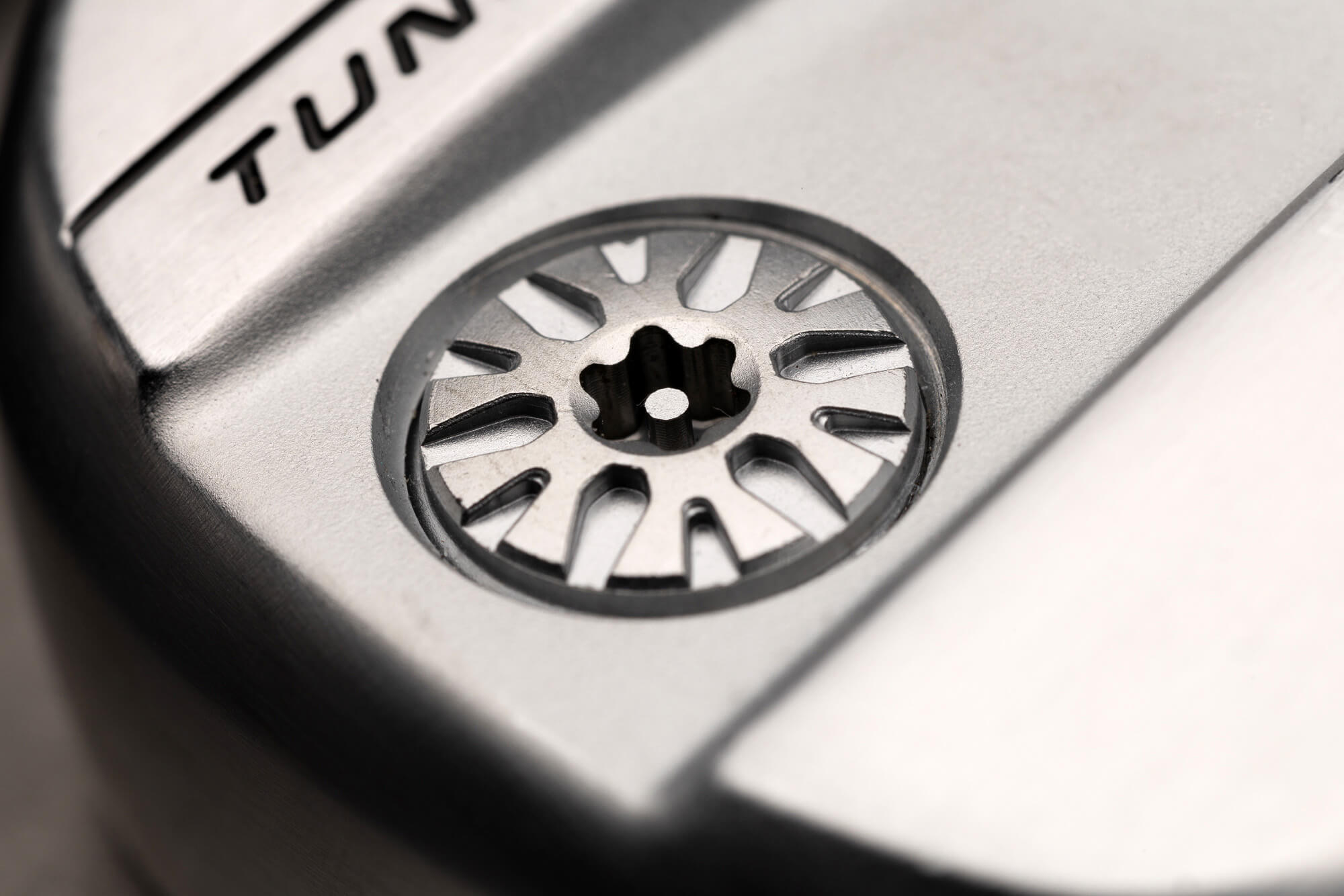 a closeup of one of the movable weights on a PXG 0311 GEN8 iron