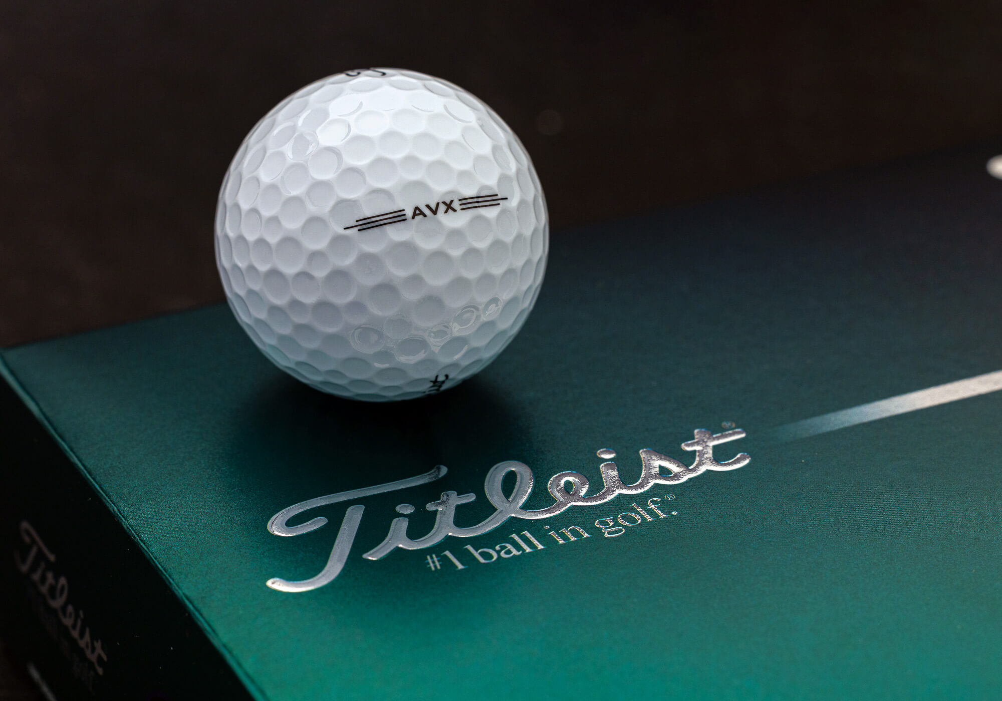 A Titleist AVX ball in a box.