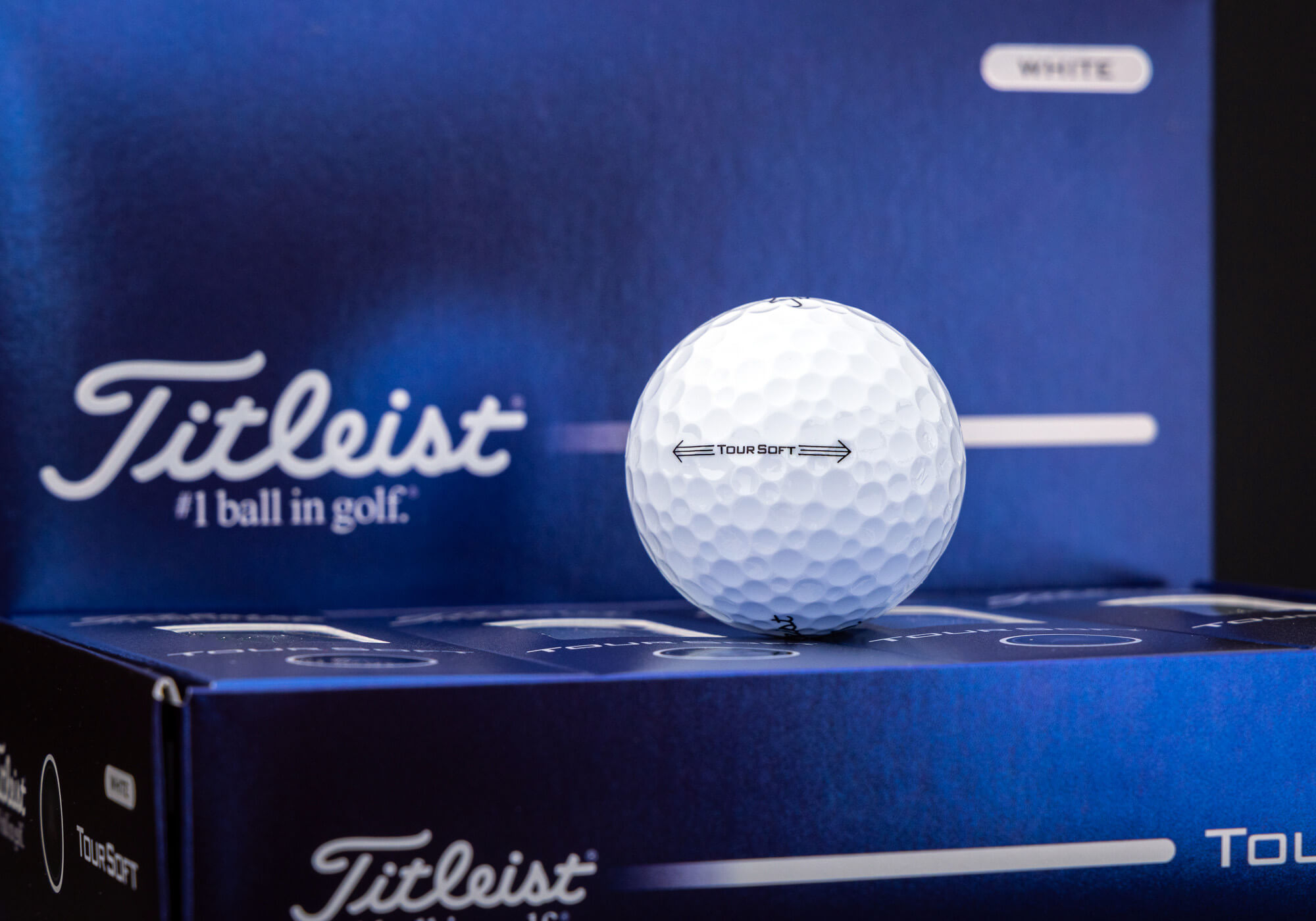 A soft Titleist tournament golf ball that rests in a box