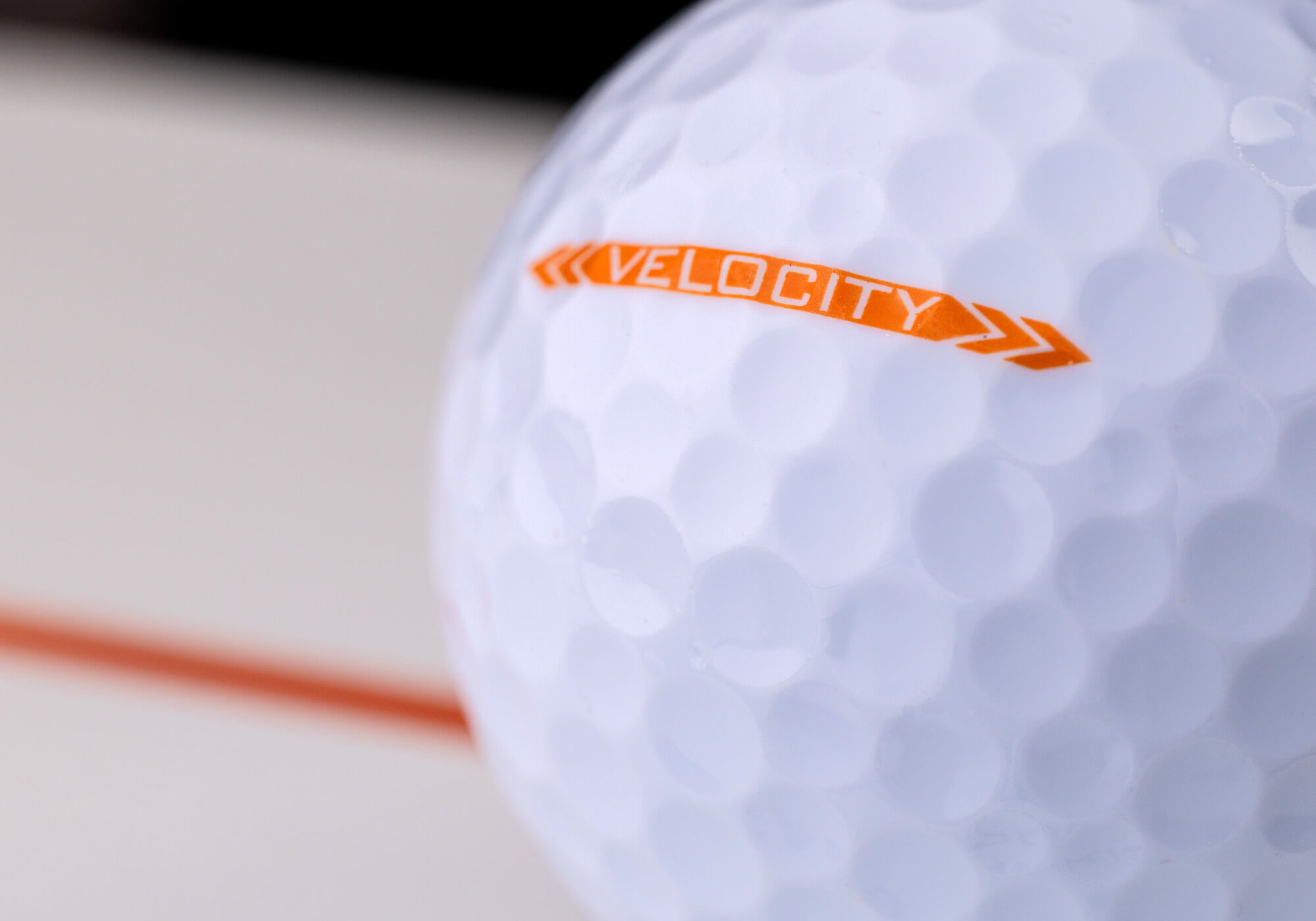 A close-up of the side knob on a Titleist Velocity golf ball