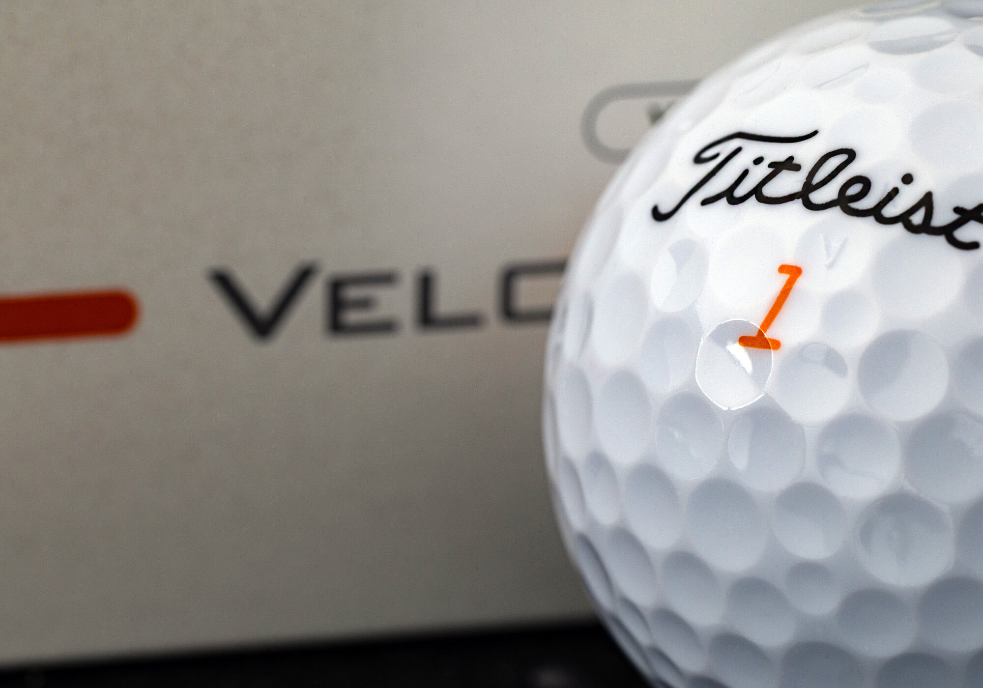 A close-up of a Titleist Velocity golf ball