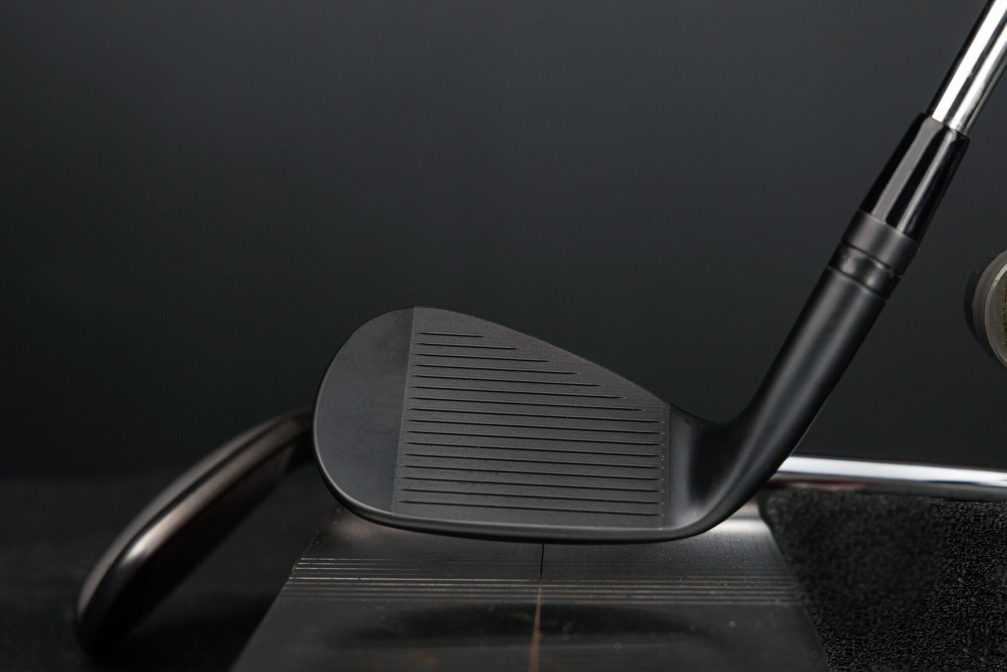 A face view of Jet Black Vokey SM11 wedge