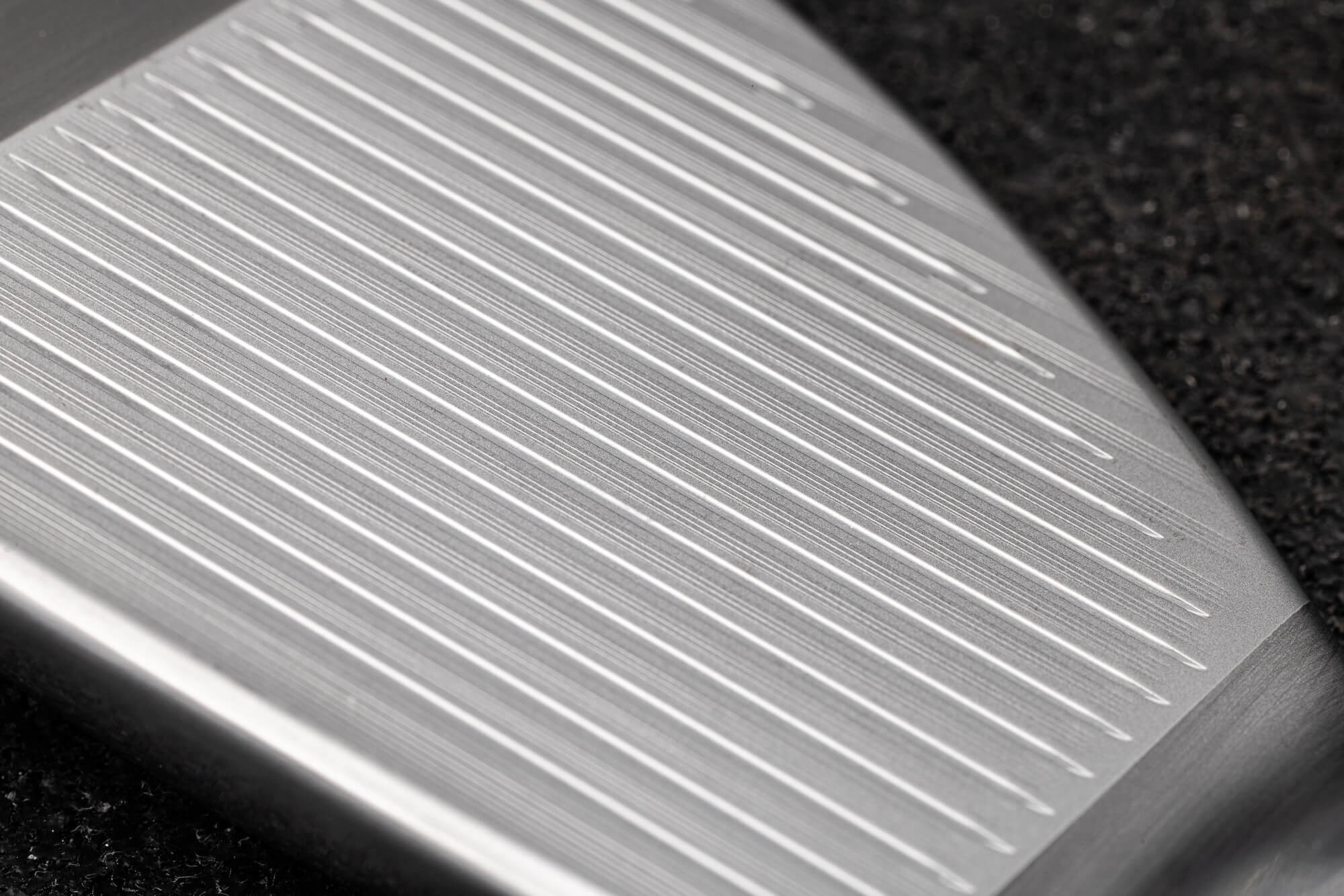 A closeup of the grooves on a Vokey SM11 wedge