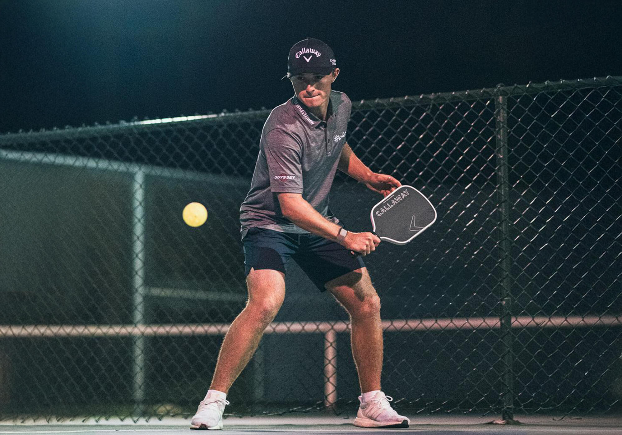 a golfer playing pickleball with a Callaway paddle