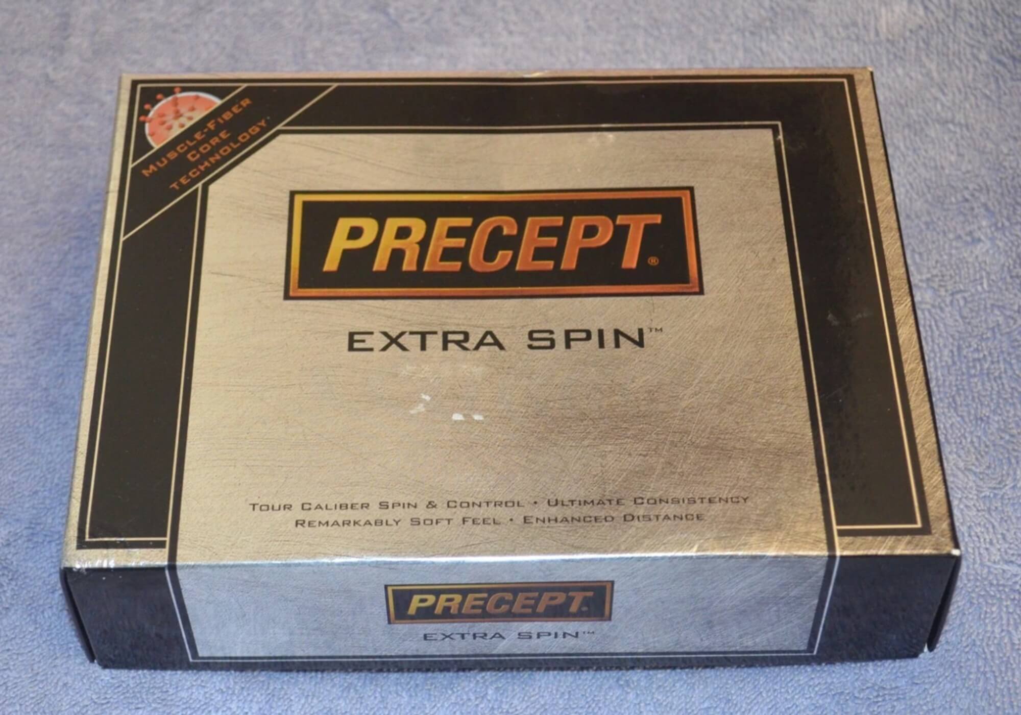 Precept Extra Spin golf balls, made by Bridgestone.
