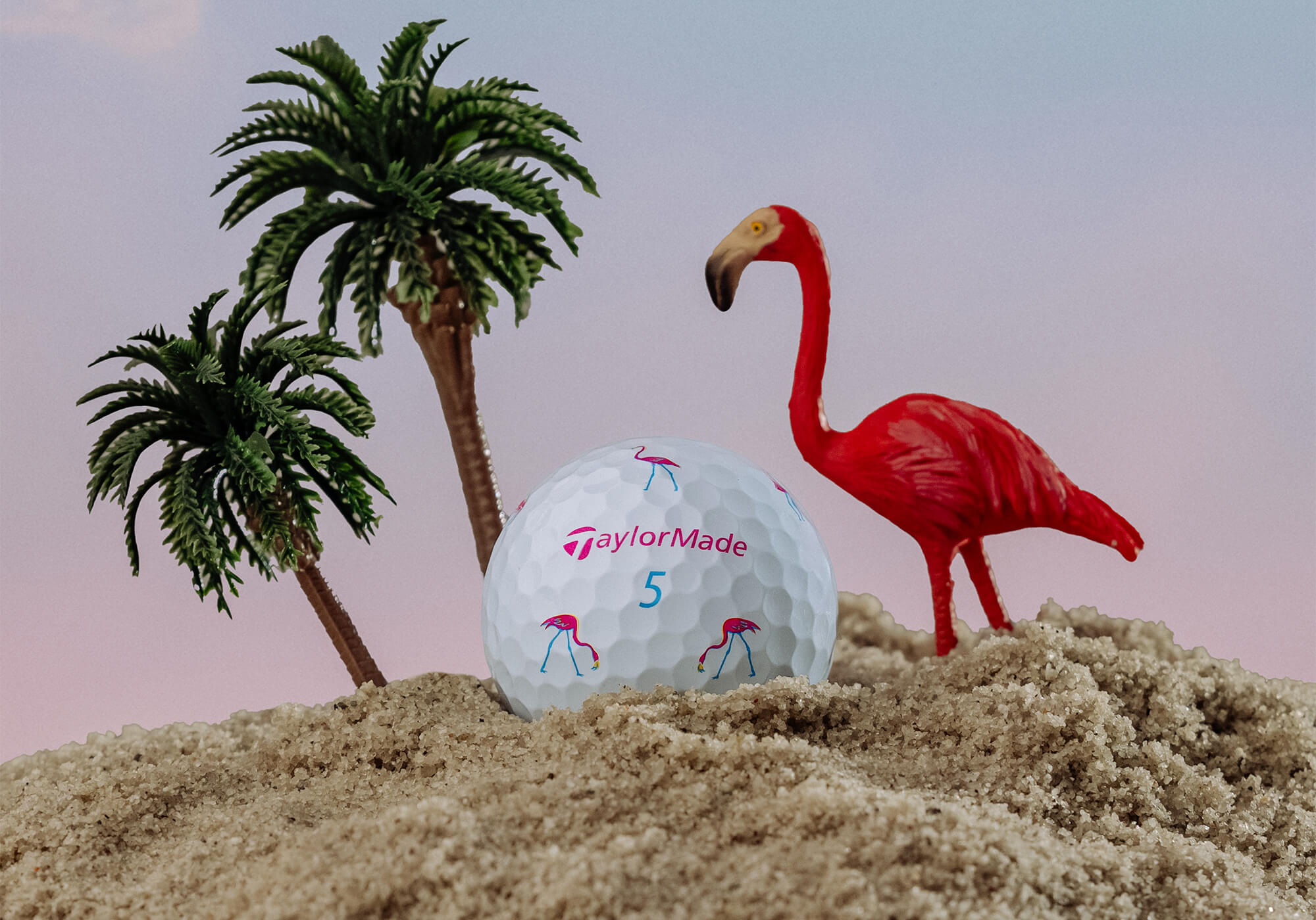TaylorMade TP5 Flamingo golf ball, closeup on the beach